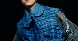 Stylish blue attire featuring a unique texture, showcasing modern fashion elements by 劉伊庭. Trendy and innovative design.