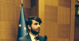 Roberto Lo Galbo speaking at a podium, showcasing professional engagement and leadership in a formal setting.