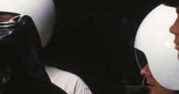 Dark helmeted character with crew in futuristic uniforms from Spaceballs, showcasing iconic parody style and humor.