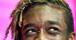 Lil Uzi Vert smiling with unique piercings and stylish green hair, showcasing his vibrant personality and musical flair.