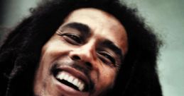 Bob Marley smiling, showcasing his iconic dreadlocks and joyful spirit, representing reggae music and cultural influence.