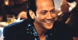 Rob Schneider smiling at a restaurant in a blue shirt, capturing the humor of "Deuce Bigalow: Male Gigolo.