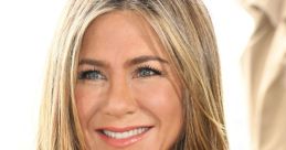 Jennifer Aniston smiles brightly, showcasing her stylish hair and elegant outfit at a promotional event.