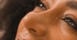 Close-up of a smiling woman with curly hair, showcasing joy and beauty, relevant to Adri in Afrikaans South Africa.