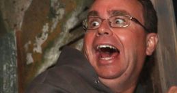 Man with wide eyes and a terrified expression, reacting in shock or fear in a thrilling situation.