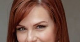 Portrait of Sara from "Unfriendly," showcasing her red hair and warm smile in a stylish outfit, exuding confidence.
