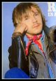 Renaud in 1980, sporting a leather jacket and bandana, captures the essence of French rock culture and style.