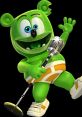 Gummibar the Gummy Bear sings joyfully into a microphone, showcasing excitement in his vibrant green character style.