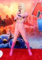 Anya Taylor-Joy as Princess Peach, showcasing a playful pose in stylish pink attire at The Super Mario Bros. Movie premiere.