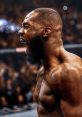 Jon Bones-Jones celebrates passionately after a fight, showcasing his athleticism and intensity in the octagon.