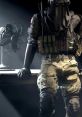 Armored character in tactical gear stands beside a fan, embodying the intense atmosphere of COD Forlan (Live Voice).