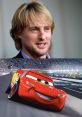 Owen Wilson as Lightning McQueen, the animated racing car, showcases charm and speed on the racetrack.