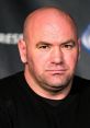 Dana White with a serious expression, speaking at a press event, showcasing his leadership in the UFC.