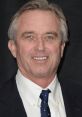 Robert F. Kennedy Jr. smiling confidently in a formal outfit, showcasing his engagement in public life and advocacy.