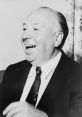 Alfred Hitchcock smiling during an interview, showcasing his iconic charm and wit as a master of suspense in cinema.