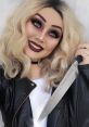 Tiffany Valentine-inspired look with dramatic makeup and a knife, showcasing a blend of glam and horror aesthetics.