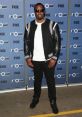 P Diddy showcases his style at "The Four" event, exuding confidence in a trendy black and white outfit.