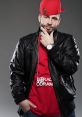 DJ Drama showcases his signature style in a bold red cap and leather jacket, presenting a confident, urban look.