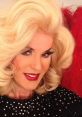 Wendy impersonator showcasing glamorous makeup and stylish blonde curls, ready to entertain with vibrant personality.