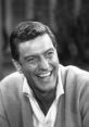 Rob Petrie character laughs warmly, embodying the charm of classic 1960s television with Dick Van Dyke's iconic performance.