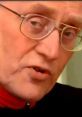 Close-up of a distinguished gentleman with glasses, showcasing wisdom and charisma in thoughtful expression.