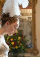Lady Whistledown-inspired character in elegant gown, adorned with feathers, showcased in opulent setting with vibrant floral backdrop.