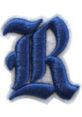 Embroidered logo of Rehobeth Rebels Baseball featuring a stylized blue "R" on a white background.