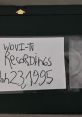 Label on a VHS tape reads "WOVI-TV Recordings, Jan 23, 1995," showcasing archival media related to TV history.