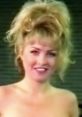 Lisa Marie, featuring a glamorous hairstyle and cheerful smile, embodies vintage charm and allure in a classic moment.