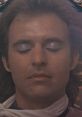 Close-up of a young man with closed eyes, evoking the soulful essence of "Love Is Alive" by Gary Wright.