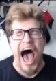 Person expressing intense emotion with a loud scream, capturing a moment of surprise or excitement related to gaming.