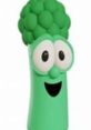 Playful green character with a smiling face and broccoli-like features, representing Junior Asparagus from VeggieTales.
