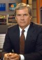 News anchor in a professional suit, presenting serious expression in a studio setting, showcasing authority in American television.