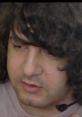 Close-up of a person speaking with a headset, focused on discussing gaming or streaming content with Alcoholicdogs V4.