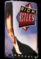 Rick Astley's iconic album cover with bold colors, featuring the singer's recognizable style and signature pose.