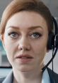 Focused expression of a woman with a headset, representing professionalism in Westlake Communications.