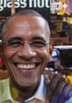 Smiling man with glasses in a vibrant urban setting, showcasing a realistic portrayal of a charismatic figure.