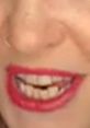 Smiling female with bold red lipstick showcasing confidence, representing non-native English speakers' vibrant personality.