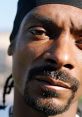 Close-up of a rapper with a confident expression, embodying Snoop Dogg's iconic style and charisma in music.