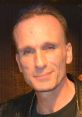 Portrait of Peter Greene, renowned actor known for diverse roles in film and television, smiling in a casual setting.