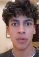 Teen with curly hair showing surprise or concern, possibly related to "King Ferran Form Royalty Family Voice (2025)".
