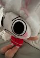 Cute plush doll with a white bunny hat, big eyes, and red outfit, perfect for fans of EY-themed characters.