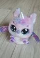 Adorable Puffycorn plush toy with big eyes, colorful fur, and sparkly wings, perfect for kids and collectors alike.