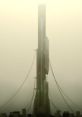 Futuristic tower shrouded in fog, inspired by Overwatch and the atmosphere of City 17 from Half-Life 2.