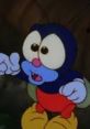 Gnatty from Thumbelina, animated blue insect with big eyes and colorful attire, expressing excitement or surprise.