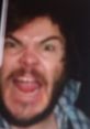 Jack Black making a wild expression, showcasing his energetic and comedic personality in a candid moment.