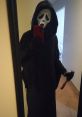 Ghostface costume featuring Vito Prete's iconic mask, holding a knife in a mirror selfie. Perfect for Halloween enthusiasts.