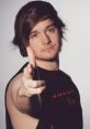 Alex Webb poses confidently, showcasing his charismatic personality and style as a wrestler and YouTuber.