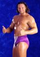 Val Venis, also known as Sean Morley, showing off his muscular physique with a thumbs-up and a confident smile.