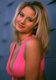 Tammy Lynn Sytch, also known as Sunny, poses in a striking pink top, showcasing her glamorous style and charm.